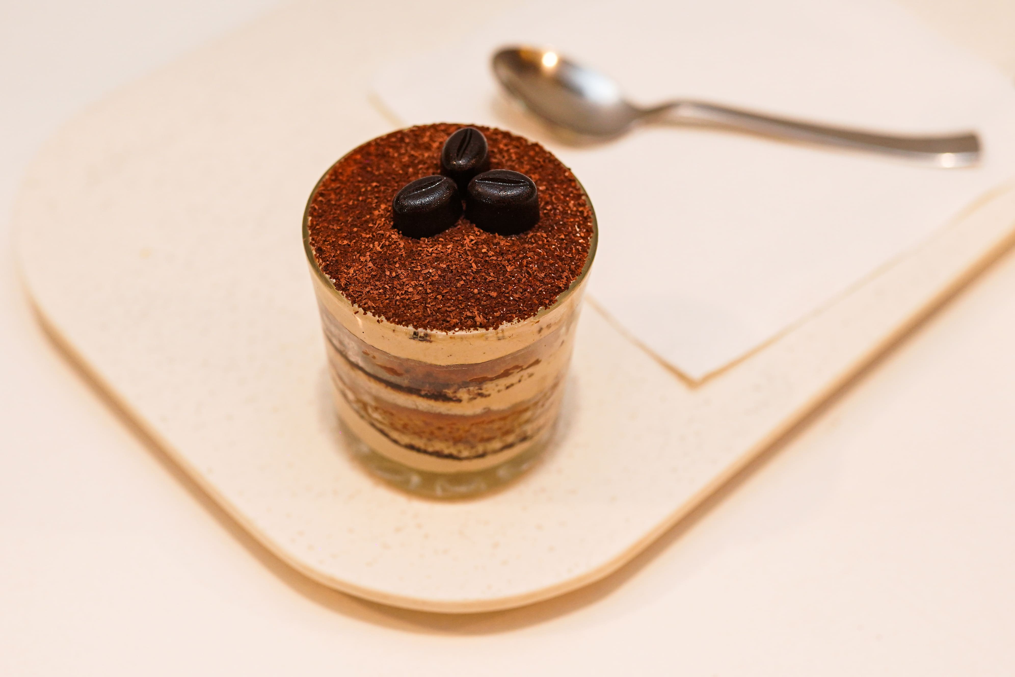 Layered coffee dessert cup with cocoa at Feranoz